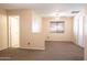 Spacious bedroom featuring neutral walls, a ceiling fan, and dual closets for ample storage and comfortable living at 10649 W Monte Vista Rd, Avondale, AZ 85392