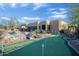 Beautiful backyard includes a putting green, pool and spa area for leisure and fun at 8167 E Sand Flower Dr, Scottsdale, AZ 85266