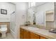 Well-lit bathroom with a single sink vanity, shower-tub combo, and walk-in closet at 8167 E Sand Flower Dr, Scottsdale, AZ 85266