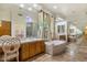 Bright bathroom features tile floor, a garden tub, double vanities, and a large window at 8167 E Sand Flower Dr, Scottsdale, AZ 85266