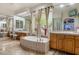 A large bathroom features tile floor, a garden tub, double vanities, and a large window at 8167 E Sand Flower Dr, Scottsdale, AZ 85266