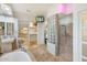 Modern bathroom boasts large vanity, soaking tub, glass block, and step-in shower at 8167 E Sand Flower Dr, Scottsdale, AZ 85266