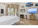 Bedroom with tile floors, large windows, modern decor, and access to outdoor space at 8167 E Sand Flower Dr, Scottsdale, AZ 85266