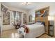 Bright bedroom with tile floors, a mini fireplace, and built-in shelving at 8167 E Sand Flower Dr, Scottsdale, AZ 85266