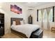 Comfortable bedroom with tiled flooring, artwork, and great natural light at 8167 E Sand Flower Dr, Scottsdale, AZ 85266