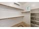 Walk-in closet with built-in shelving, ample storage space, and natural light at 8167 E Sand Flower Dr, Scottsdale, AZ 85266