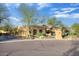 Home's driveway and entry featuring desert landscaping and a stone entry marker at 8167 E Sand Flower Dr, Scottsdale, AZ 85266