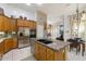 Kitchen with island, granite countertops, and stainless steel appliances at 8167 E Sand Flower Dr, Scottsdale, AZ 85266