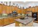 Kitchen features granite countertops and stainless steel appliances at 8167 E Sand Flower Dr, Scottsdale, AZ 85266