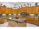 Well-lit kitchen with granite counters, island, and ample cabinet space at 8167 E Sand Flower Dr, Scottsdale, AZ 85266