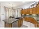 Kitchen island with granite countertops, stainless dishwasher, and tile floors at 8167 E Sand Flower Dr, Scottsdale, AZ 85266