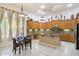 Bright kitchen with island, granite countertops, and dining area at 8167 E Sand Flower Dr, Scottsdale, AZ 85266