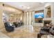 Comfortable living area with a fireplace, tile floor and modern furnishings at 8167 E Sand Flower Dr, Scottsdale, AZ 85266