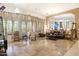 Spacious living room features large windows, tile flooring, and an open floor plan at 8167 E Sand Flower Dr, Scottsdale, AZ 85266