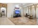 Bright living room boasts tile floors and modern entertainment center at 8167 E Sand Flower Dr, Scottsdale, AZ 85266