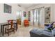 Sitting area featuring built-in shelves, a dining table, and tile flooring at 8167 E Sand Flower Dr, Scottsdale, AZ 85266