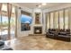 Cozy living room features fireplace and tile flooring at 8167 E Sand Flower Dr, Scottsdale, AZ 85266