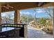 Outdoor kitchen and bar area overlooking the pool and desert landscaping at 8167 E Sand Flower Dr, Scottsdale, AZ 85266