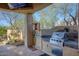Built-in outdoor grill and bar area, perfect for entertaining at 8167 E Sand Flower Dr, Scottsdale, AZ 85266