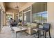 Inviting covered patio with plush seating area, ideal for relaxing and entertaining at 8167 E Sand Flower Dr, Scottsdale, AZ 85266