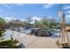 Resort-style pool area with waterfalls, desert landscaping and outdoor seating at 8167 E Sand Flower Dr, Scottsdale, AZ 85266