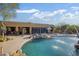 Beautiful desert landscaping surrounds the pool, with a covered patio and comfortable seating at 8167 E Sand Flower Dr, Scottsdale, AZ 85266