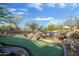 Beautiful putting green amid desert landscaping creates a unique recreational experience at 8167 E Sand Flower Dr, Scottsdale, AZ 85266