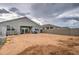 View of home's backyard showing a large lot size, patio, and block fencing at 1157 W Paradise Way, Casa Grande, AZ 85122