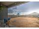 Expansive backyard with a view of the desert landscape and block wall fence at 1157 W Paradise Way, Casa Grande, AZ 85122