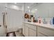 Bright bathroom with a large mirror, white cabinets, and a shower with curtain at 1157 W Paradise Way, Casa Grande, AZ 85122