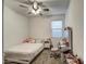 Well-lit bedroom featuring a full bed and a vanity area with a mirror at 1157 W Paradise Way, Casa Grande, AZ 85122