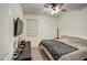 Cozy bedroom with neutral tones features a ceiling fan and comfortable queen bed at 1157 W Paradise Way, Casa Grande, AZ 85122