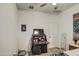 Bedroom features black desk, a television and neutral carpet at 1157 W Paradise Way, Casa Grande, AZ 85122