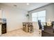 Cozy dining area with modern table set and natural light from the window at 1157 W Paradise Way, Casa Grande, AZ 85122