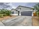 Charming single-story home featuring a two-car garage, desert landscaping, and modern architectural details at 1157 W Paradise Way, Casa Grande, AZ 85122