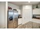 Well-equipped kitchen with stainless steel refrigerator and ample counter space at 1157 W Paradise Way, Casa Grande, AZ 85122