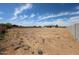 Expansive vacant lot with block wall, offering endless possibilities for landscaping and outdoor living at 1101 E Dolores Rd, Phoenix, AZ 85086