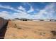 Expansive vacant lot with block wall, offering endless possibilities for landscaping and outdoor living at 1101 E Dolores Rd, Phoenix, AZ 85086