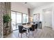 Dining area with wooden table, black chairs, and access to patio at 1101 E Dolores Rd, Phoenix, AZ 85086