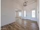 Bright entryway with wood-look tile floors and a modern chandelier at 1101 E Dolores Rd, Phoenix, AZ 85086