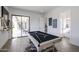 Game room with pool table, adjacent bathroom, and patio access at 1101 E Dolores Rd, Phoenix, AZ 85086