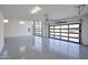 Bright and spacious garage with glass garage door and epoxy flooring at 1101 E Dolores Rd, Phoenix, AZ 85086