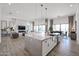 Modern kitchen island with white cabinets, stainless steel appliances, and open layout at 1101 E Dolores Rd, Phoenix, AZ 85086