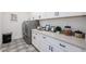 Laundry room with washer, dryer, and additional storage cabinets at 1101 E Dolores Rd, Phoenix, AZ 85086