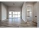Bright living room featuring sliding glass doors to the outside and modern tile flooring at 1101 E Dolores Rd, Phoenix, AZ 85086