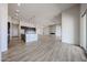 Open-concept kitchen and living area with tiled floors, a fireplace, and stainless appliances at 1101 E Dolores Rd, Phoenix, AZ 85086