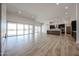 Spacious open living room with sliding glass doors and a contemporary kitchen island at 1101 E Dolores Rd, Phoenix, AZ 85086