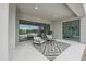 Relaxing covered patio with comfortable seating and access to the pool and backyard at 1101 E Dolores Rd, Phoenix, AZ 85086
