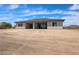 Inviting single-story home with a covered patio and expansive desert views, ideal for outdoor entertaining and relaxation at 1101 E Dolores Rd, Phoenix, AZ 85086