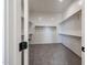 Neat walk-in closet with lots of shelving space for storage at 1101 E Dolores Rd, Phoenix, AZ 85086
